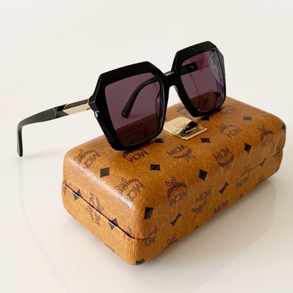 MCM Black Frame Sunglasses with Dark Purple Lenses